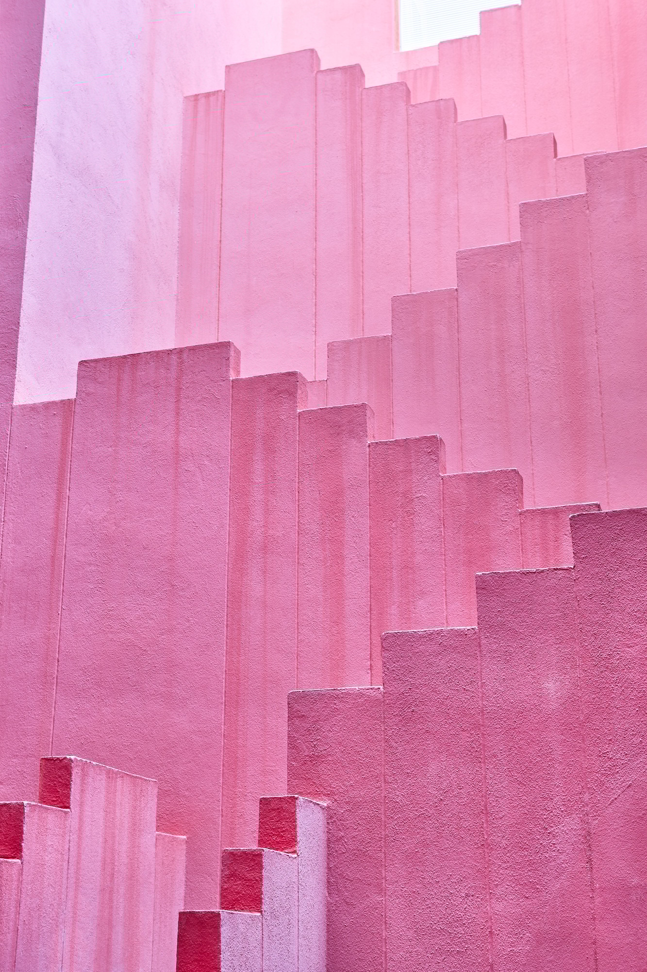 Geometric building structure in pink tone. Alicante, Spain